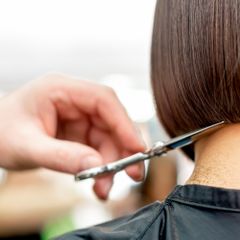 hairdresser-s-hand-cutting-hair-tips